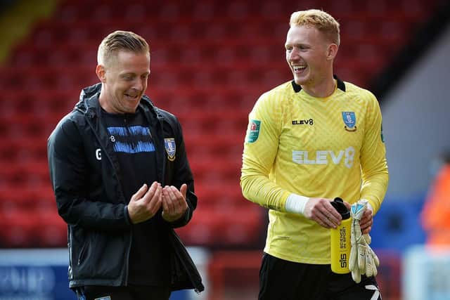 Penalty Shoot Out..Owls keeper Cameron Dawson with Garry Monk Pic Steve Ellis