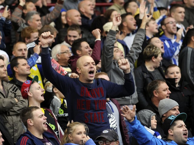 A Sheffield Wednesday fan celebrating a goal at Oakwell in 2013
