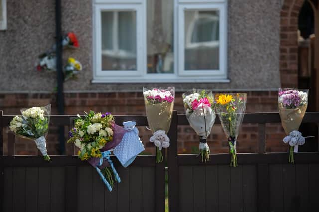 Flowers outside the house in which a 12 day old baby was mauled to death by a dog near Doncaster, South York., September 17 2020.