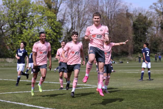 Zak Brunt celebrates after putting United's U23s ahead at Millwall: David Klein / Sportimage