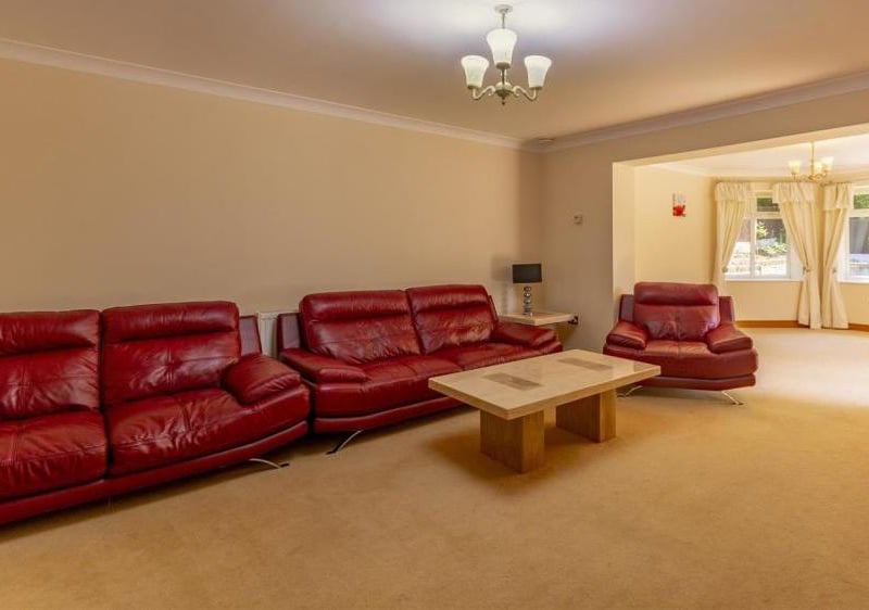 Another reception room, complete with luxurious leather sofas. Warm and comfortable.