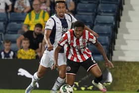 Rhian Brewster of Sheffield United is challenged by Callum Robinson of West Bromwich Albion: Andrew Yates / Sportimage