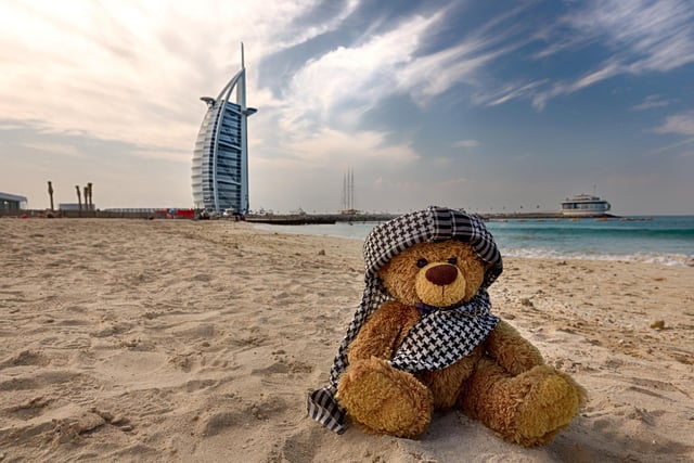 John James the teddy bear at Dubai on the beach in front of Burj al Arab.
These adorable teddy bears could be the world's most well-travelled cuddly toys - as their photographer owner has chronicled their adventures in 27 different countries. Christian Kneidinger, 57, has been travelling with his teddy bears, named John and Bob since 2014 - and his taken them to some of the world's most famous landmarks. The teddy bears have dressed up in traditional Emirati clothing to visit the Sultan's Palace in Oman, and have braved the cold on a glacier on Lofoten Island in Norway.