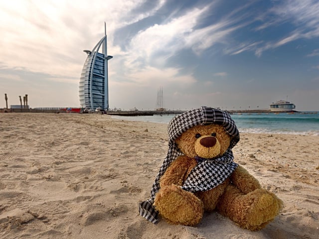 John James the teddy bear at Dubai on the beach in front of Burj al Arab.
These adorable teddy bears could be the world's most well-travelled cuddly toys - as their photographer owner has chronicled their adventures in 27 different countries. Christian Kneidinger, 57, has been travelling with his teddy bears, named John and Bob since 2014 - and his taken them to some of the world's most famous landmarks. The teddy bears have dressed up in traditional Emirati clothing to visit the Sultan's Palace in Oman, and have braved the cold on a glacier on Lofoten Island in Norway.