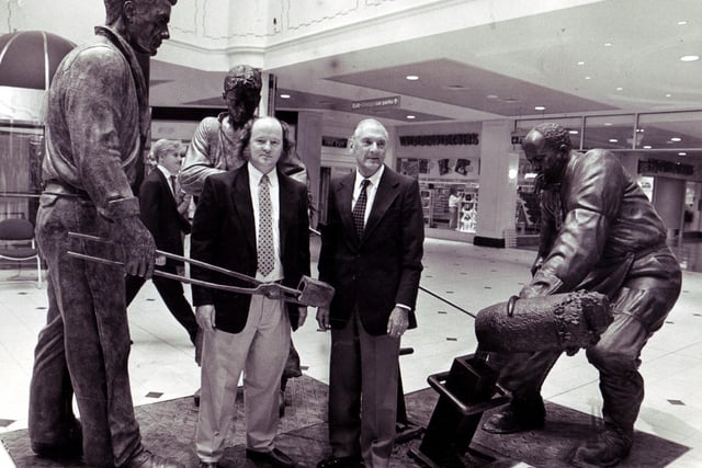 Sheffield teemer George Dalton, left, and sculptor, Robin Bell, with the bronze figures depicting the traditional steel teeming that were unveiled by Mr Dalton at Meadowhall Shopping Centre in September 1990