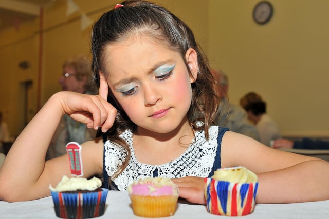 Camille Nixon considers her cake options during the Elwick Village Royal Jubilee Celebration eight years ago.