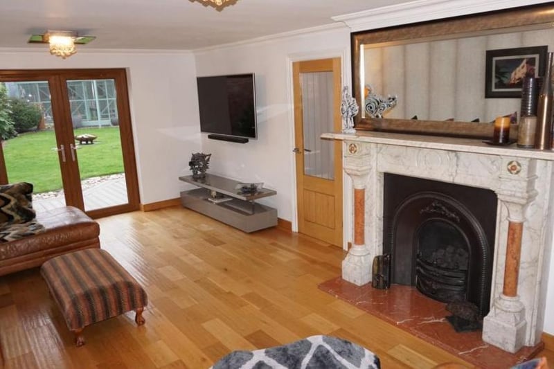 Full-length lounge with a splendid period fireplace.