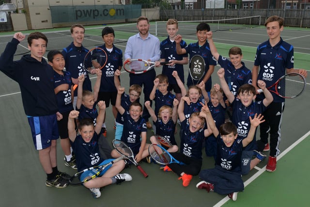 Brendan Garvey, HR manager at EDF, presents Jonny Hyde from Hartlepool Lawn Tennis Club with a new shirt, as fellow club members and players look on. Remember this from five years ago?