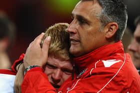 United's Elliott Whitehouse is consoled by manager John Pemberton after defeat in the FA Youth Cup final (Photo by Laurence Griffiths/Getty Images)