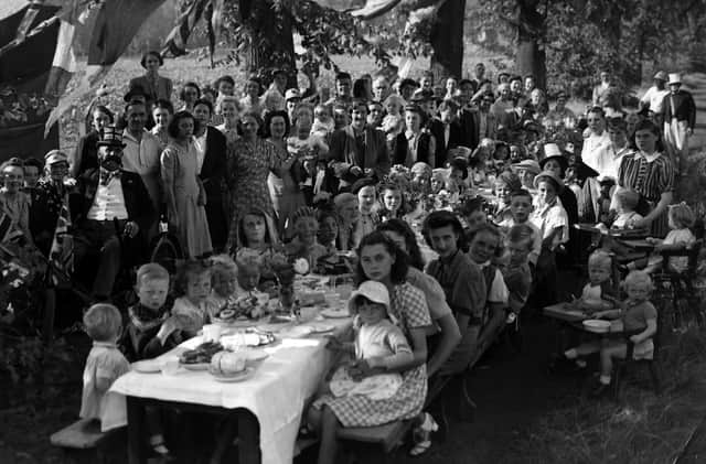 VE Day St James’s Hospital, Milton. Under shady trees to keep off the hot sun staff and their children from St Jame’s Hospital celebrate the peace with a party.