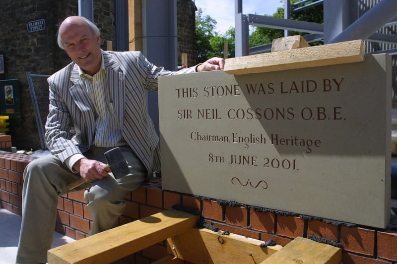 Sir Neil Cossons laying a stone.
