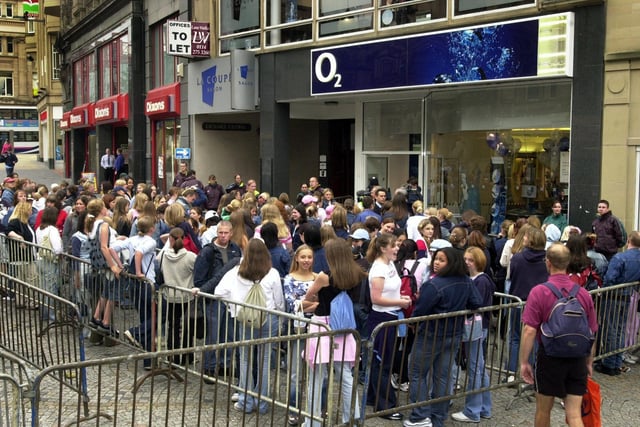Crowds wait for boy band Blue to open the new O2 shop on Fargate, Sheffield, August 12, 2002