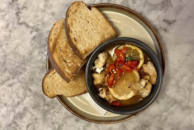 The Gambas Pil Pil is a saucy affair with king prawns served in a spicy garlic sauce and toasted sourdough loaf