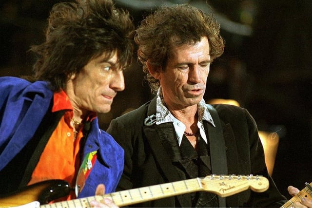 An intense look from guitarist Ronnie Wood towards bandmate Keith Richards on stage as the Rolling Stones kicked off the British leg of their Voodoo Lounge tour at Don Valley Stadium, Sheffield on July 9, 1975