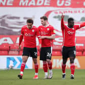Daryl Dike of Barnsley celebrates with teammates Carlton Morris, Michael Sollbauer and Callum Brittain after scoring during the Sky Bet Championship match between Barnsley and Birmingham City at Oakwell  (Photo by Alex Pantling/Getty Images)