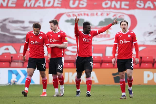 Daryl Dike of Barnsley celebrates with teammates Carlton Morris, Michael Sollbauer and Callum Brittain after scoring during the Sky Bet Championship match between Barnsley and Birmingham City at Oakwell  (Photo by Alex Pantling/Getty Images)