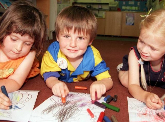 Charlotte Hicks, Joe Malia and Olivia De Rosa enjoying colouring books in Doncaster Central Library, 1999.