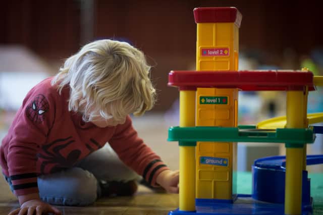 A young boy plays with toys at a playgroup for pre-school aged children. Picture: Matt Cardy/Getty Images.