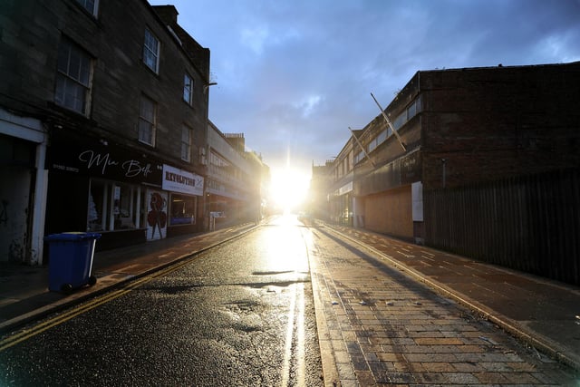 The low winter sun cannot hide the fact that the High Street of Kirkcaldy is empty at the start of the January 2021 lockdown which has everyone legally required to stay at home 
(Pic: Fife Photo Agency)
