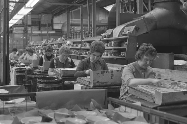 Pyrex workers at the Sunderland factory of James A Jobling and Co are pictured applying transfers to tableware for world markets in 1975.