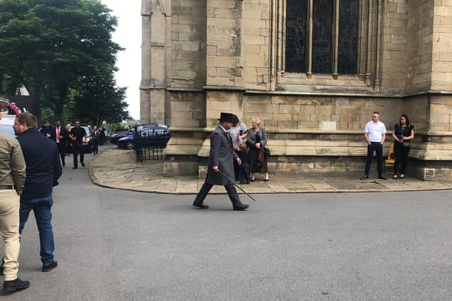 The cortege arrives at the minster