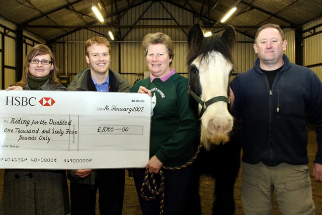 Royal Mail Service Team Leader Kate Roddis and Customer Service Advisor Richard Old presented a cheque for £1065 to Secretary of Riding for the Disabled Dorothy Hartshorn, Winston the horse and Bryan Hartshorn after a sponsored abseil at Miller's Dale viaduct in 2007