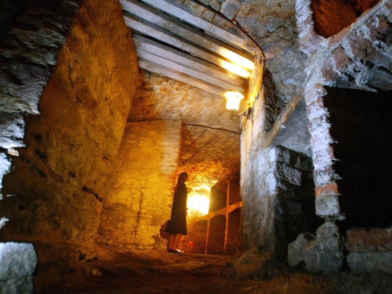 Hidden beneath Edinburgh’s South Bridge, these underground chambers were once workshops and taverns before becoming overcrowded slums plagued by poverty and crime. Today, the vaults are famous for reports of a hostile spirit known as ‘The Watcher’ or ‘Mr Boots’, described as a tall, dark figure in a long coat and tricorn hat. Visitors have reported heavy footsteps, unexplained touches, scratches and bruises, while another ghost, a young boy called Jack, is said to playfully tug at people’s clothes.