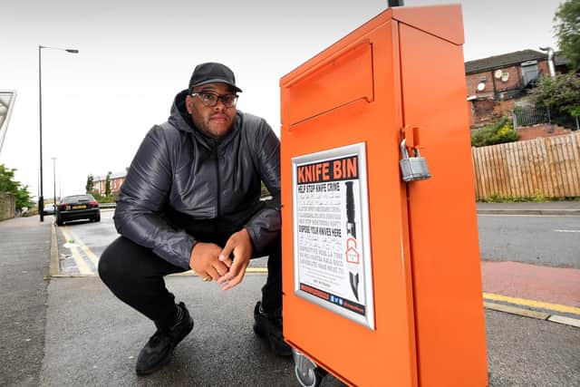 Anthony Olaseinde pictured with the knife bin on Carlisle Street, Sheffield...27th  July 2020..Picture by Simon Hulme 