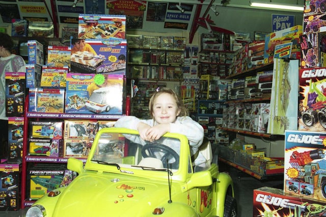 Here's a scene from Christmas 1992 and it shows a child enjoying the vast array of goodies in Joseph's toy shop. Did you love to pay a visit?