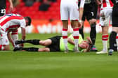 Referee David Webb takes a hit and falls injured during the Sky Bet Championship match between Stoke City and Sheffield United (Cameron Smith/Getty Images)
