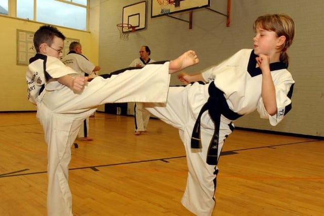 Children Connor Haliday and Amy Atmore aged eight and 10 having fun with martial arts in 2005.