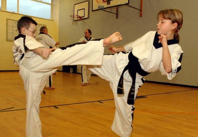 Children Connor Haliday and Amy Atmore aged eight and 10 having fun with martial arts in 2005.