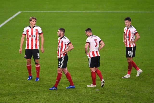 Dejected Sheffield United players after their 2-0 defeat to Wolves at Bramall Lane. Picture: Laurence Griffiths/NMC Pool/PA Wire.