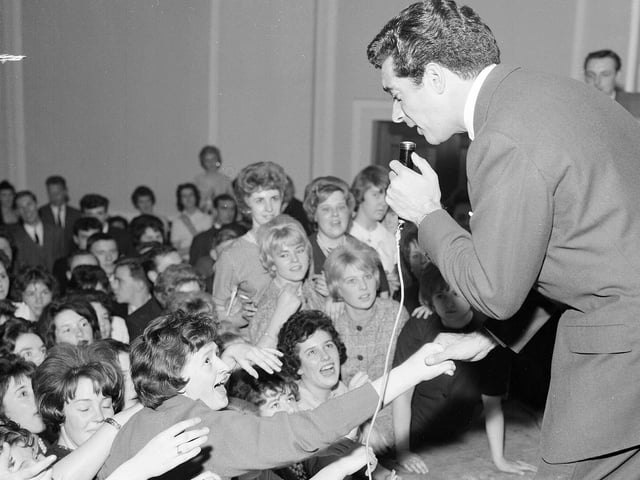 Pop fan Irene Smith reaches out to touch singer Frankie Vaughan at a gig in Leith Town Hall, Edinburgh, in 1961