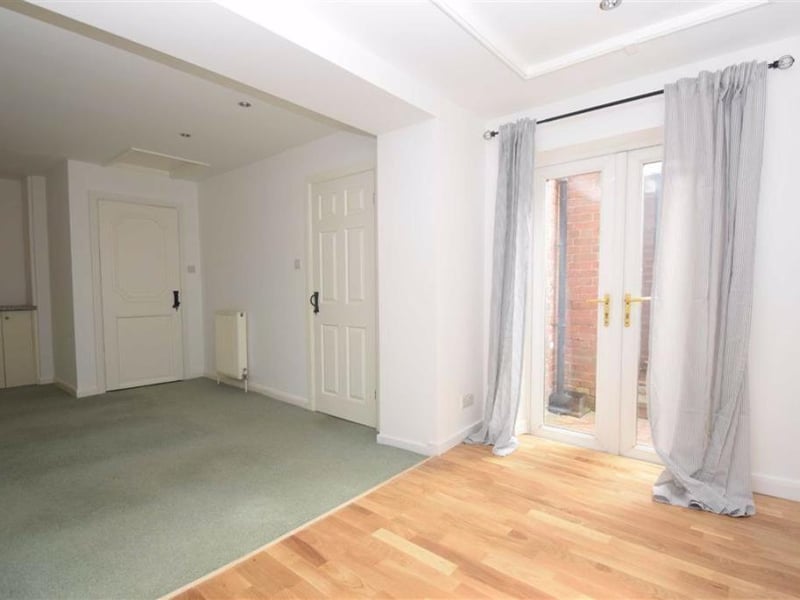 Master bedroom with ensuite and double doors to rear garden.
