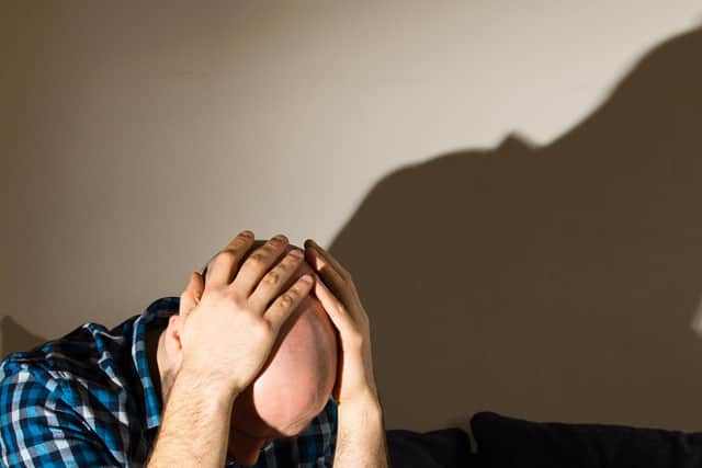 PICTURE POSED BY MODEL. A man showing signs of depression. PRESS ASSOCIATION Photo.