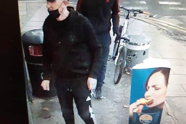 The police have released a CCTV image of two men wanted for a knifepoint robbery in Barnsley