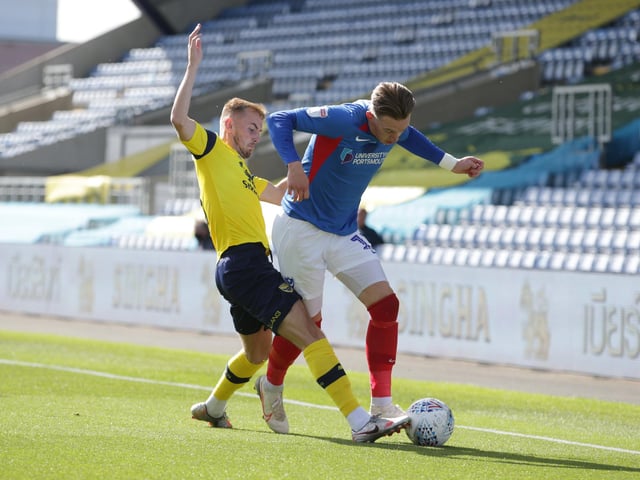 Ronan Curtis breaks free of Mark Sykes of Oxford United