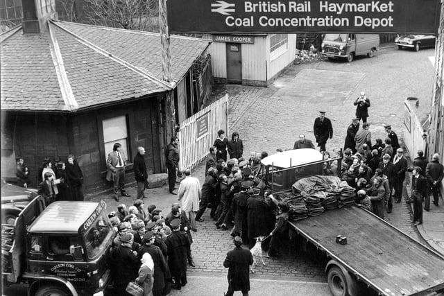 Police move in when pickets mob the driver of a lorry collecting coal from Haymarket.