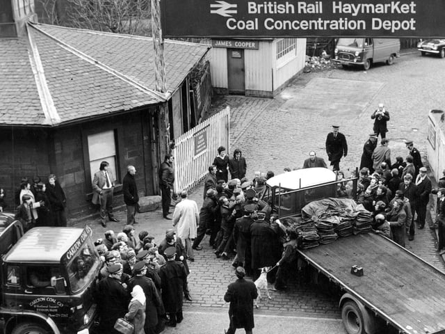 Police move in when pickets mob the driver of a lorry collecting coal from Haymarket.
