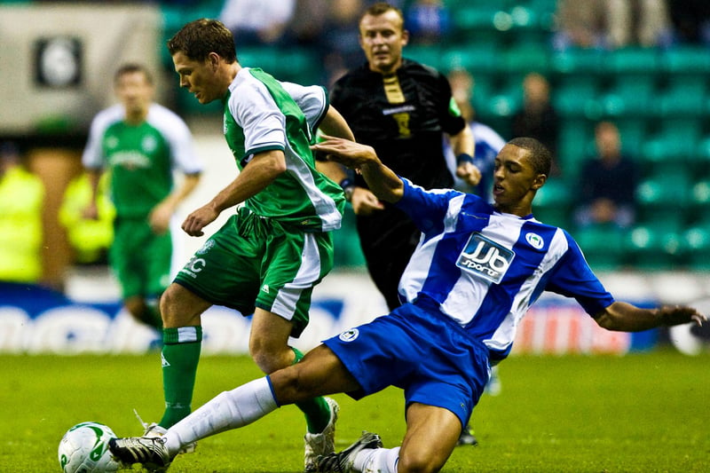 John Rankin (left) gets away from Wigan's Lewis Montrose in an August 2008 friendly. Amr Zaki scored the only goal as the Latics won 1-0