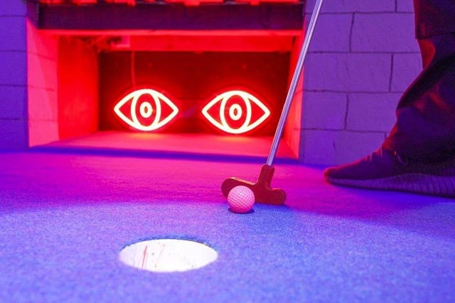 ‘Gloryholes’ bar and 18+-only golf opened in the city centre at the back end of last year .
The crazy golf venue features a number of adult-themed displays, neon lights and risqué decorations inside.