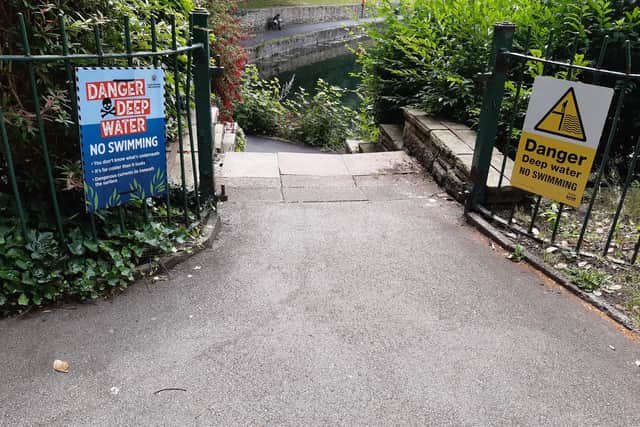 Two of the new signs put in place warning people against swimming in Crookes Valley Park
