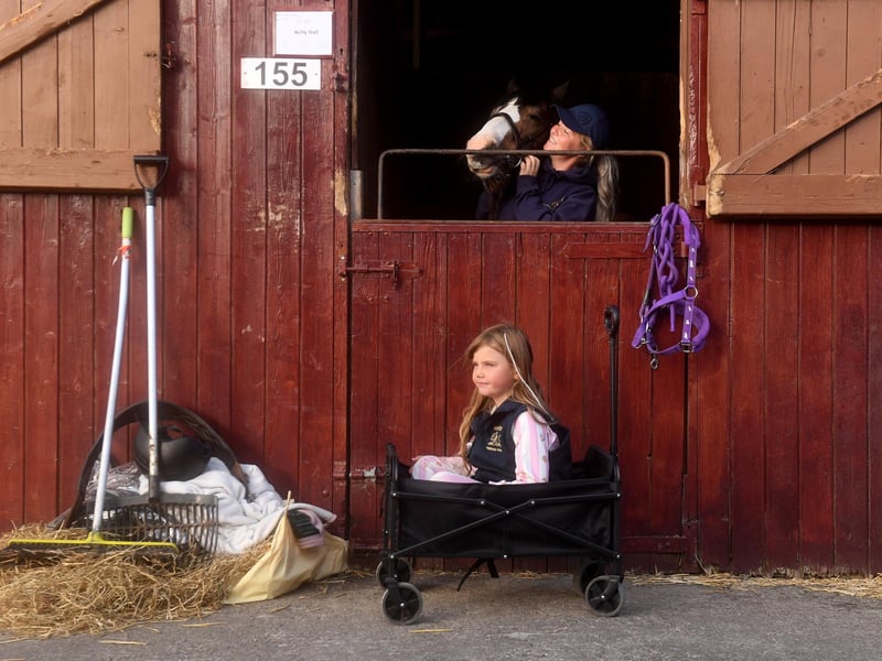 Grace Sharp, aged 7, is pictured with Katie Bradley and their pony Pinky at the show.