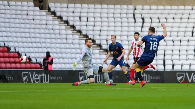 Mansfield Town forward Rhys Oates grabs an early goal against Sunderland.
