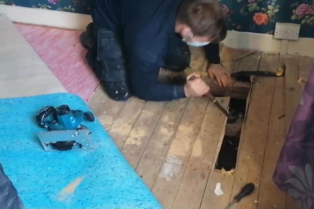 A suspected burglar was found hiding under floorboards in a house in Sheffield in a bid to evade arrest