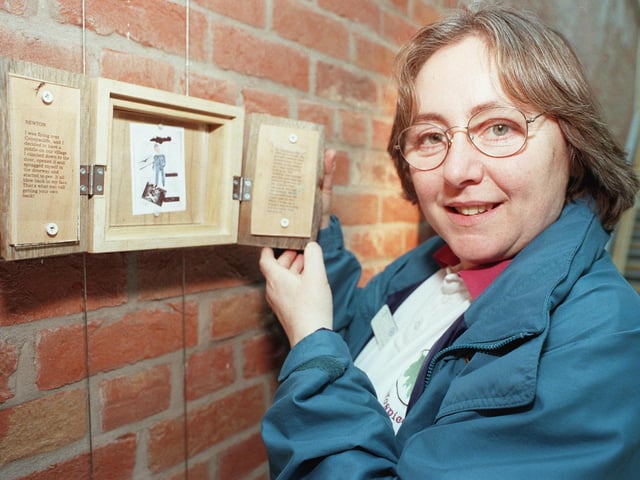 St. Johns Hospice O.T. Daycare leader, Caroline Taylor, with one of the many Hospice patients works which have been mounted by an artist and are on show  at The Point in Doncaster back in 2000