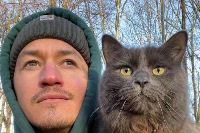 A dog-like adventurous cat enjoys hikes and bike rides with its owner and is soon to go on camping trips. Kyle Kana'iaupuni Robertson, 31, got his cat Pōhaku in March last year.