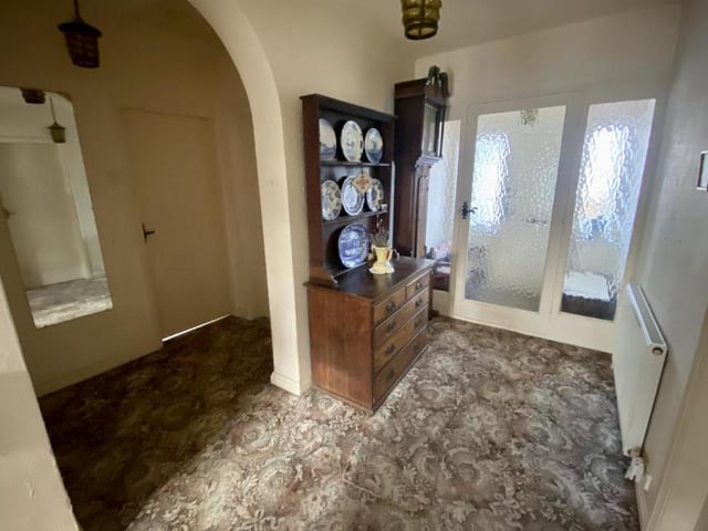 The front door and porch lead to this entrance hallway, which immediately gives the bungalow a warm and homely feel. It has access to all the ground-floor rooms.