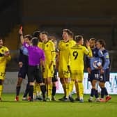 Alex Mowatt of Barnsley FC is shown a red card during the Sky Bet Championship match between Wycombe Wanderers and Barnsley.
